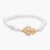 Silver bracelet Heart of Viana in filigree, part of The Classics Collection.  The Heart of Viana was created as a symbol of devotion to the Sacred Heart but soon became an icon and emotional heritage of Portugal.  Gold plated silver 925‰ center with 1,5cm and 1,0 gr. Elastic pearl bracelet. Handmade in Portugal.